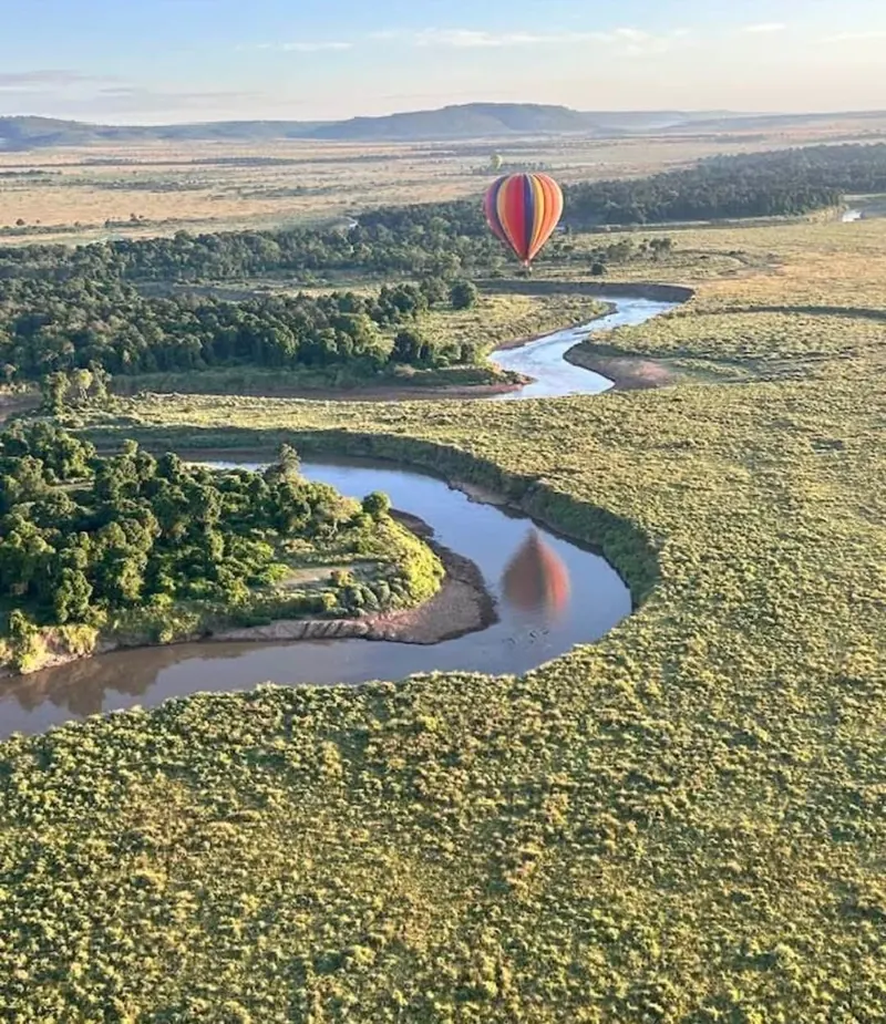 Hot Air Balloon Above a Winding Safari River